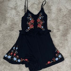 Blue, red, and black romper with pockets